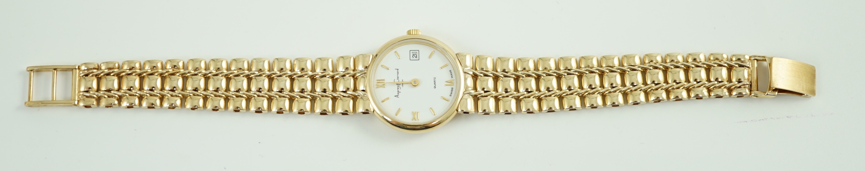 A lady's 2002 9ct gold Asprey & Garrard quartz wrist watch, on a 9ct gold bracelet